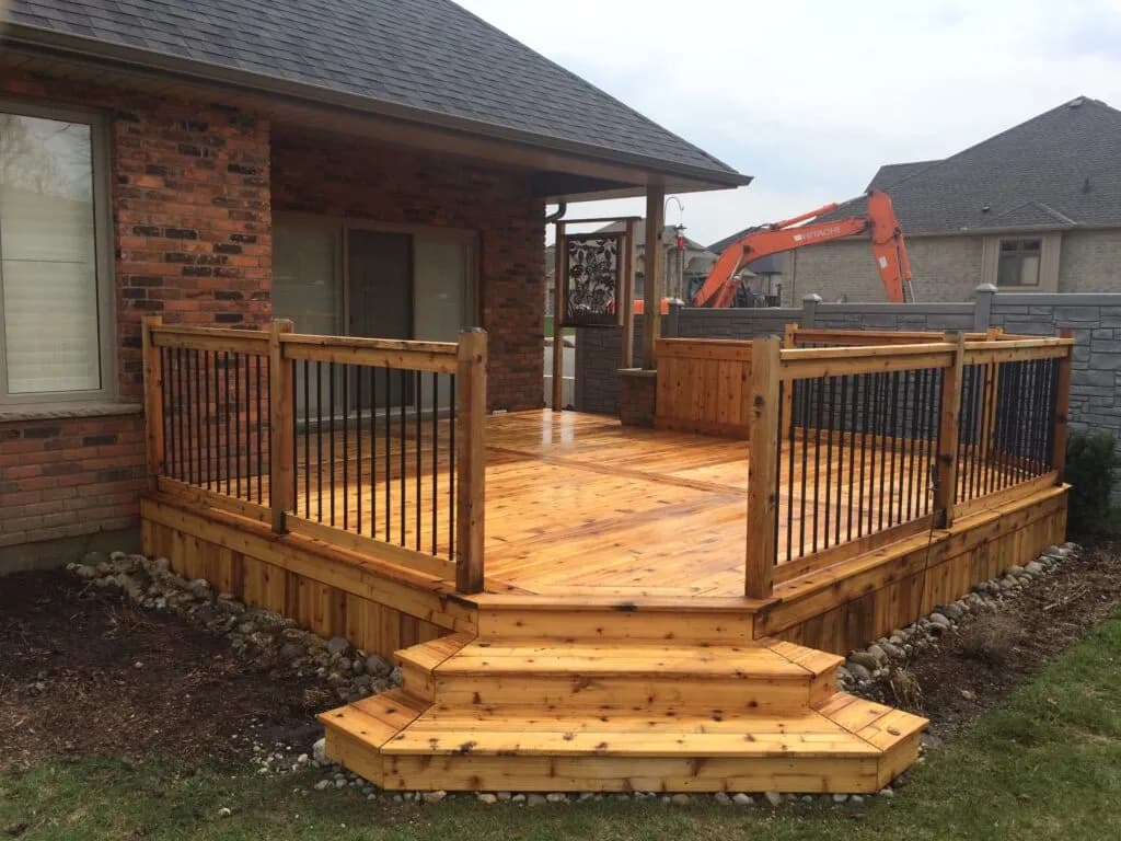 Professional deck staining in progress — Toronto Deck Stainers applying premium stain